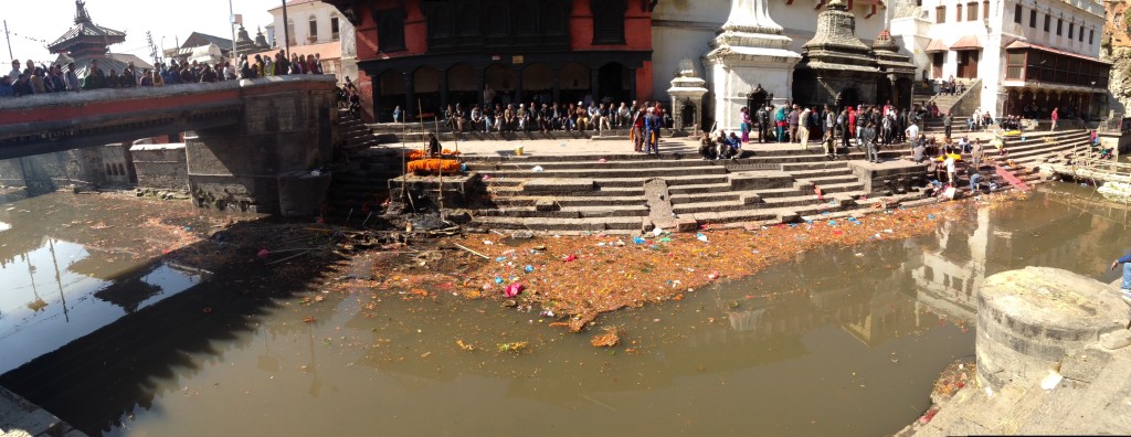 One of the most unique cultural things I've witnessed to date is here in the Nepali culture, how they go about their funeral ceremony. The river here is sacred... holy... interesting how culturally the river is sacred, and how truly everyone throws trash into it without thinking or seemingly caring. It seems that the truly don't see it as a bad thing to throw trash anywhere and everywhere. Very notable difference in culture, I thought. So their funeral ceremony involves bringing the bodies of their loved ones down to the river, erecting a lovely funeral pyre, covering it with beautiful flowers.. dipping their loved ones' feet in the river, ceremoniously putting them on the pyre, and burning their bodies to ash ultimately putting all the ashes into the river as well. It was very moving to witness this part of the Nepali culture.. stayed here for hours, just bearing witness and paying simple respects as best we could as those clearly from outside this culture and religion.